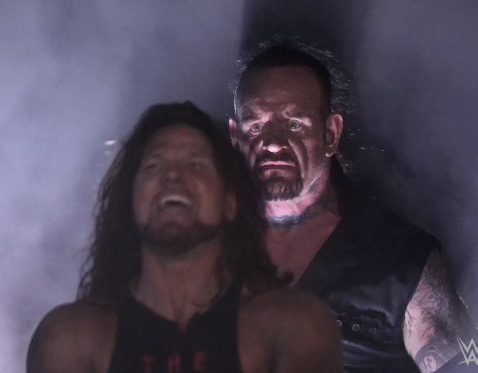 Undertaker Standing Behind AJ Styles meme template blank